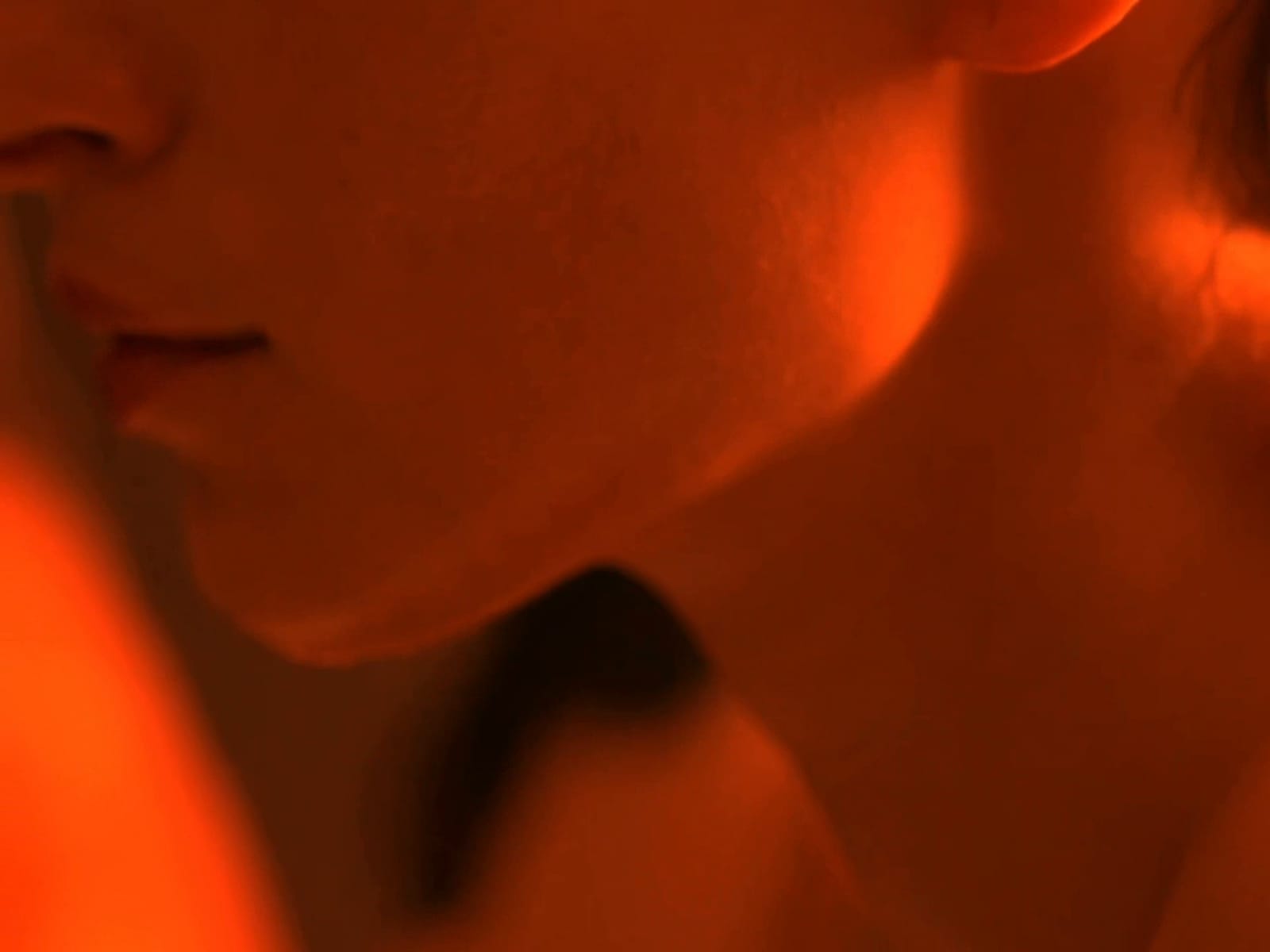 Neck and shoulder in the warm light of the sauna